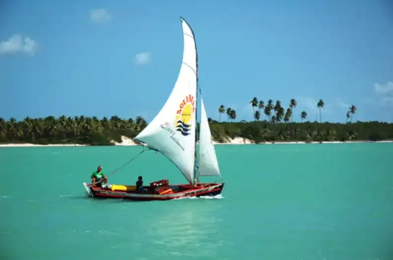 Jangada no mar calmo da Barra do Cunhaú